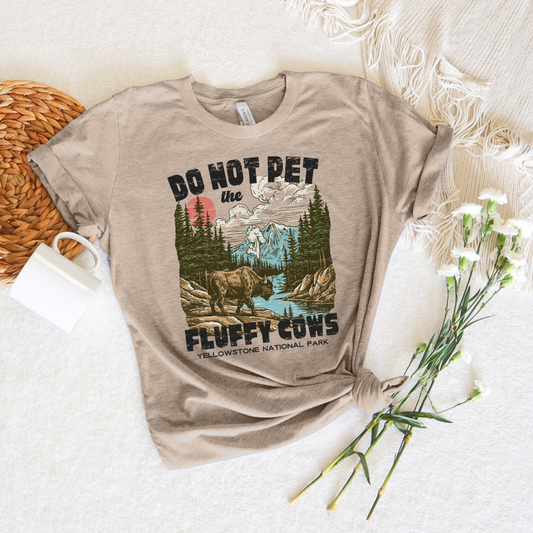 Do Not Pet the Fluffy Cows graphic tee with highland cow illustration